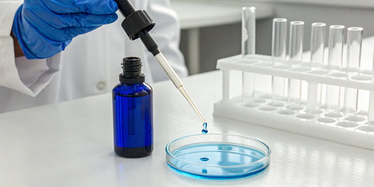 Researcher in a lab studying the benefits of GHK-Cu peptide for skin.